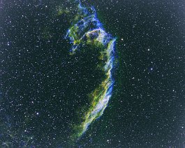 Veil Nebula (NGC 6992) The Veil Nebula is a cloud of heated and ionized gas and dust in the constellation Cygnus. It constitutes the visible portions of the Cygnus Loop, a supernova...