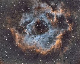 Rosette Nebula The Rosette Nebula (also known as Caldwell 49) is a large spherical H II region located near one end of a giant molecular cloud in the Monoceros region of the...