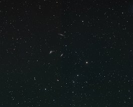 Leo Triplet Mike captured this wide-field image of the Leo Triplet region on April 3, 2021. Galaxies M66 and M65 are below edge-on NGC 3628. At least 10 other fainter...